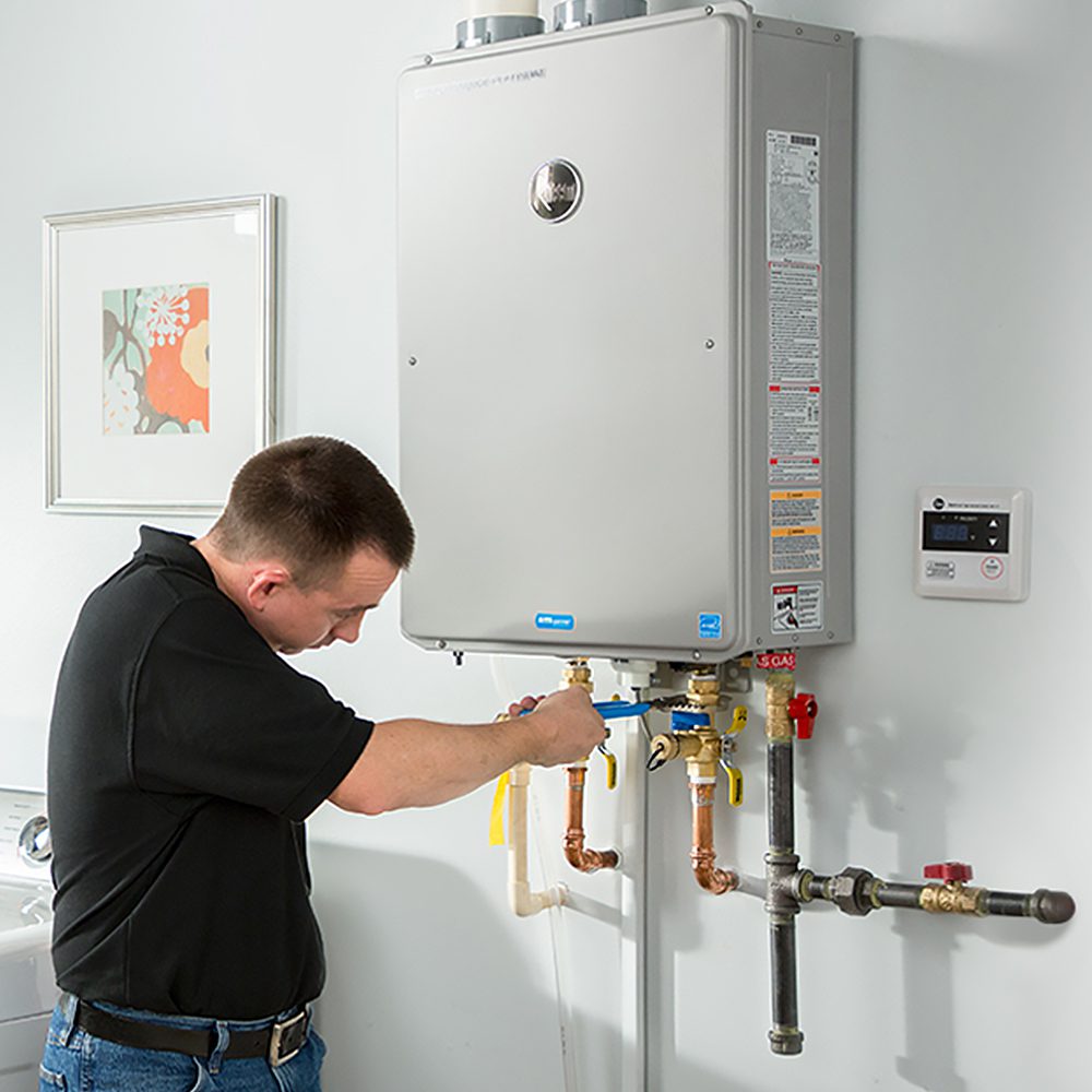 plumber servicing tankless water heater